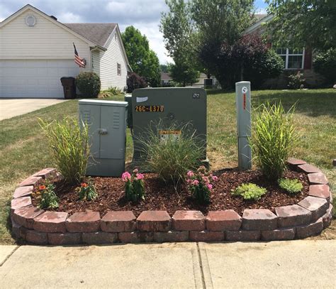 hiding electrical box outside|hiding utility boxes in garden.